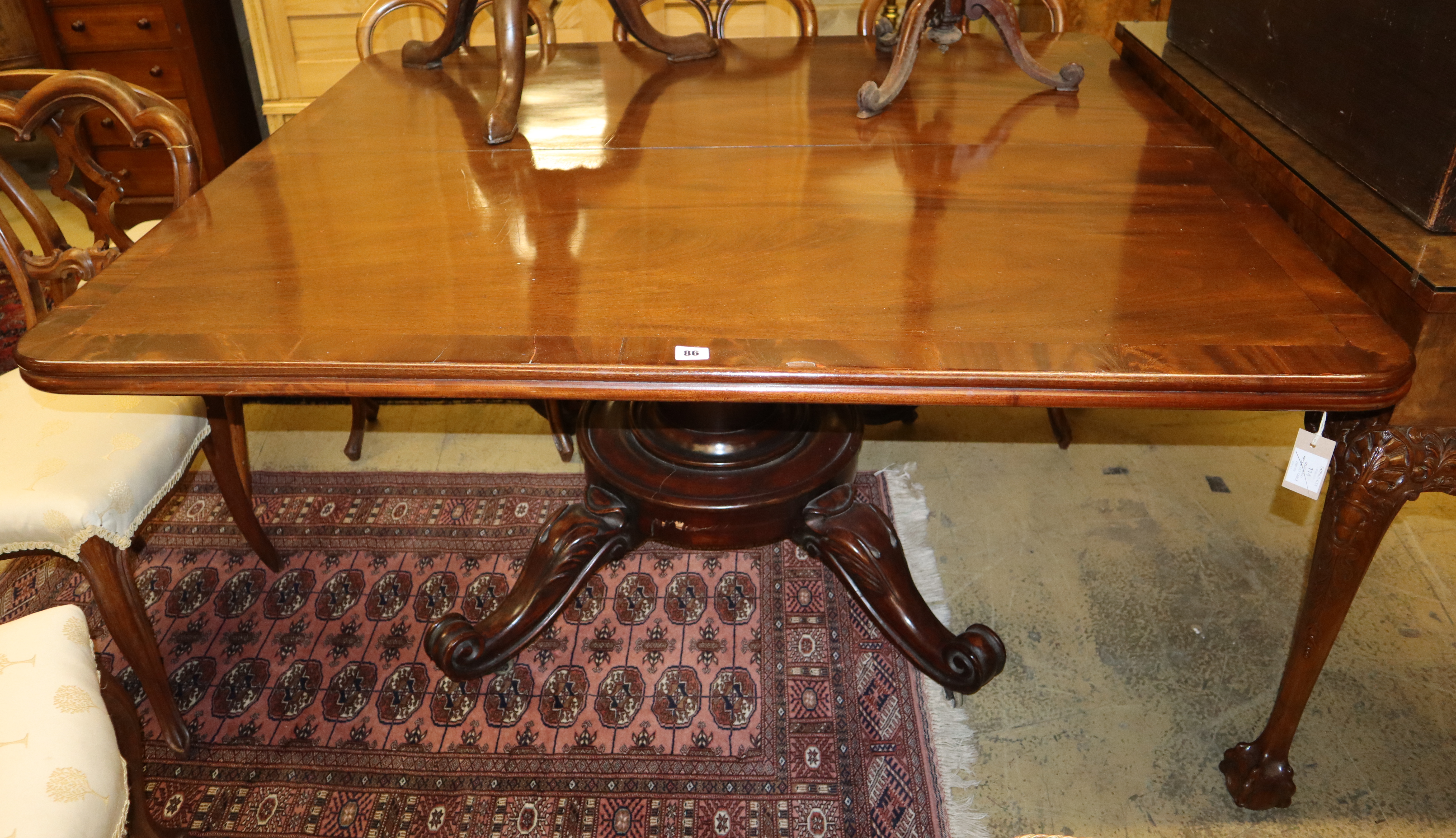 A Victorian style mahogany dining table, W.140cm, D.125cm, H.72cm